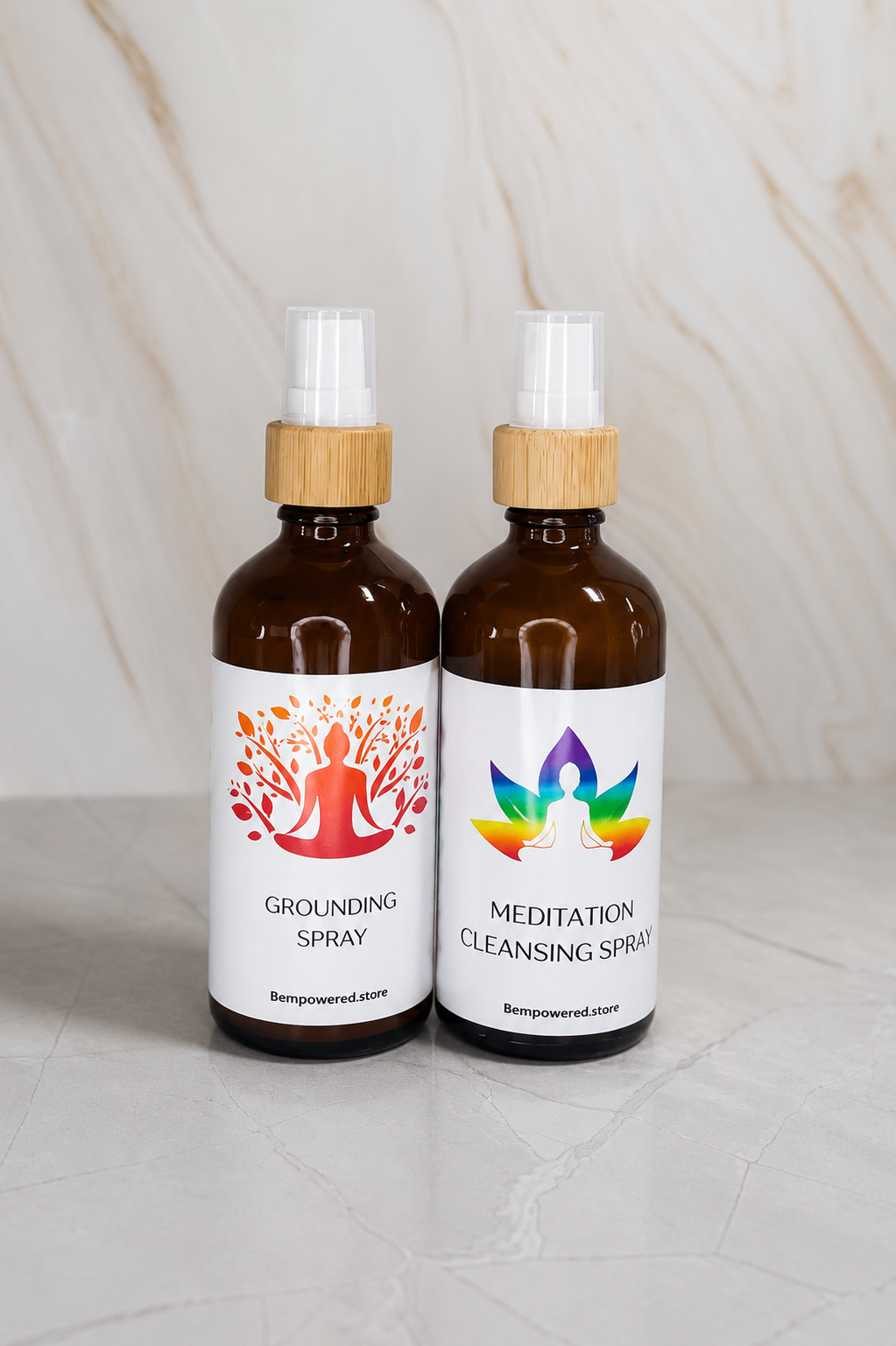Grounding Spray and Meditation Cleansing Spray amber bottles together on marble.