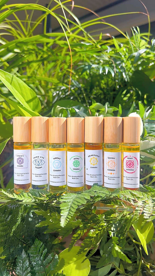 The seven chakra roll-on blends in sunlit greenery