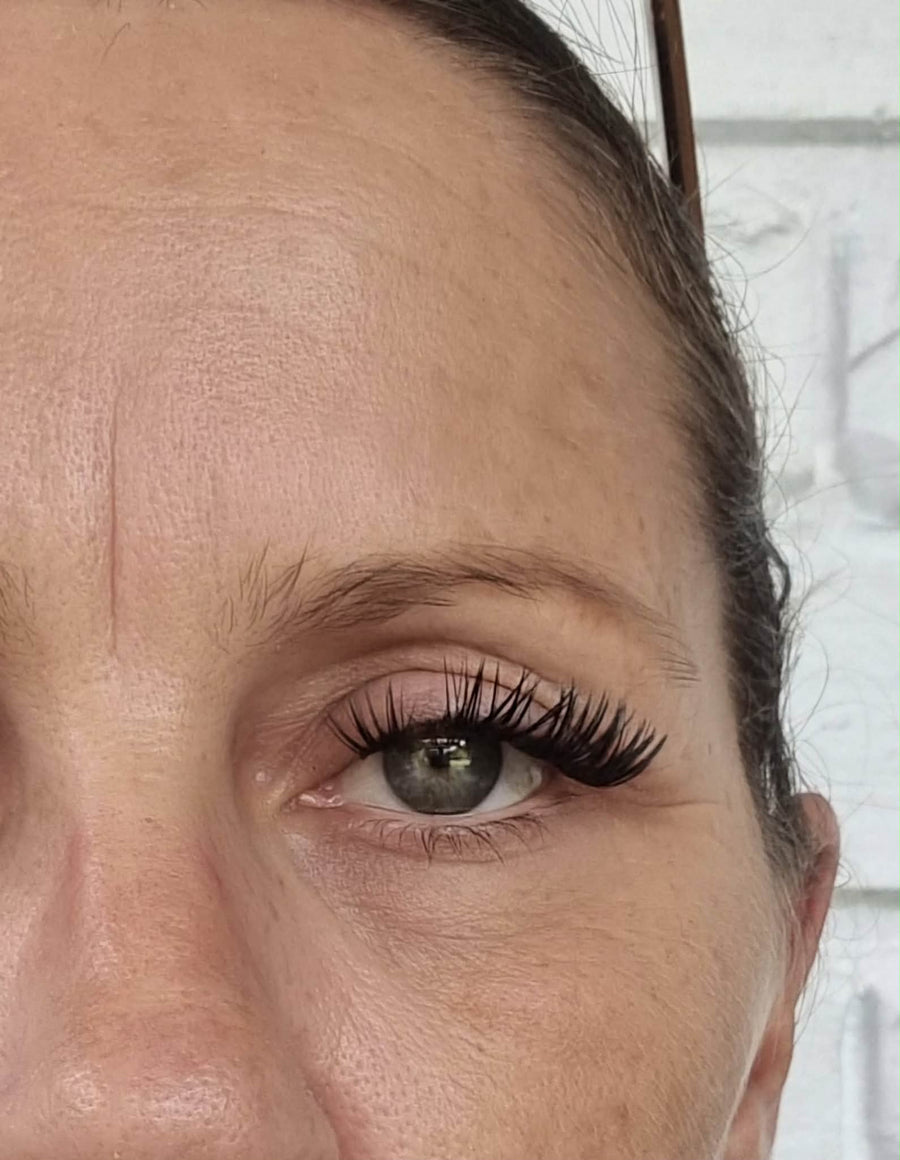 Customer’s close-up photograph one month later, with different lash styling